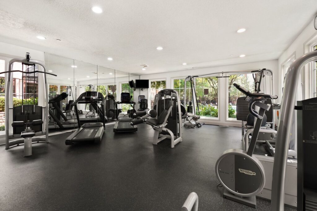 Spacious gym interior featuring modern cardio and strength equipment for a comprehensive workout.